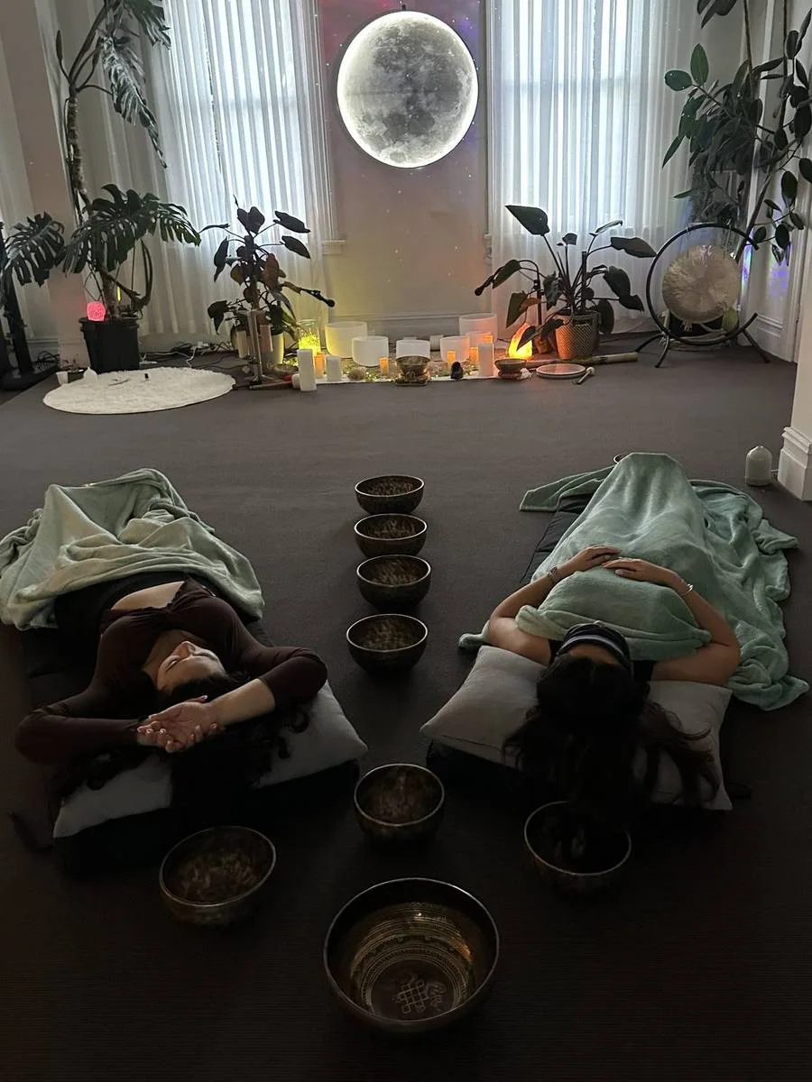 Two guests resting during a private sound bath under blankets at Mystic Wellness Petersham